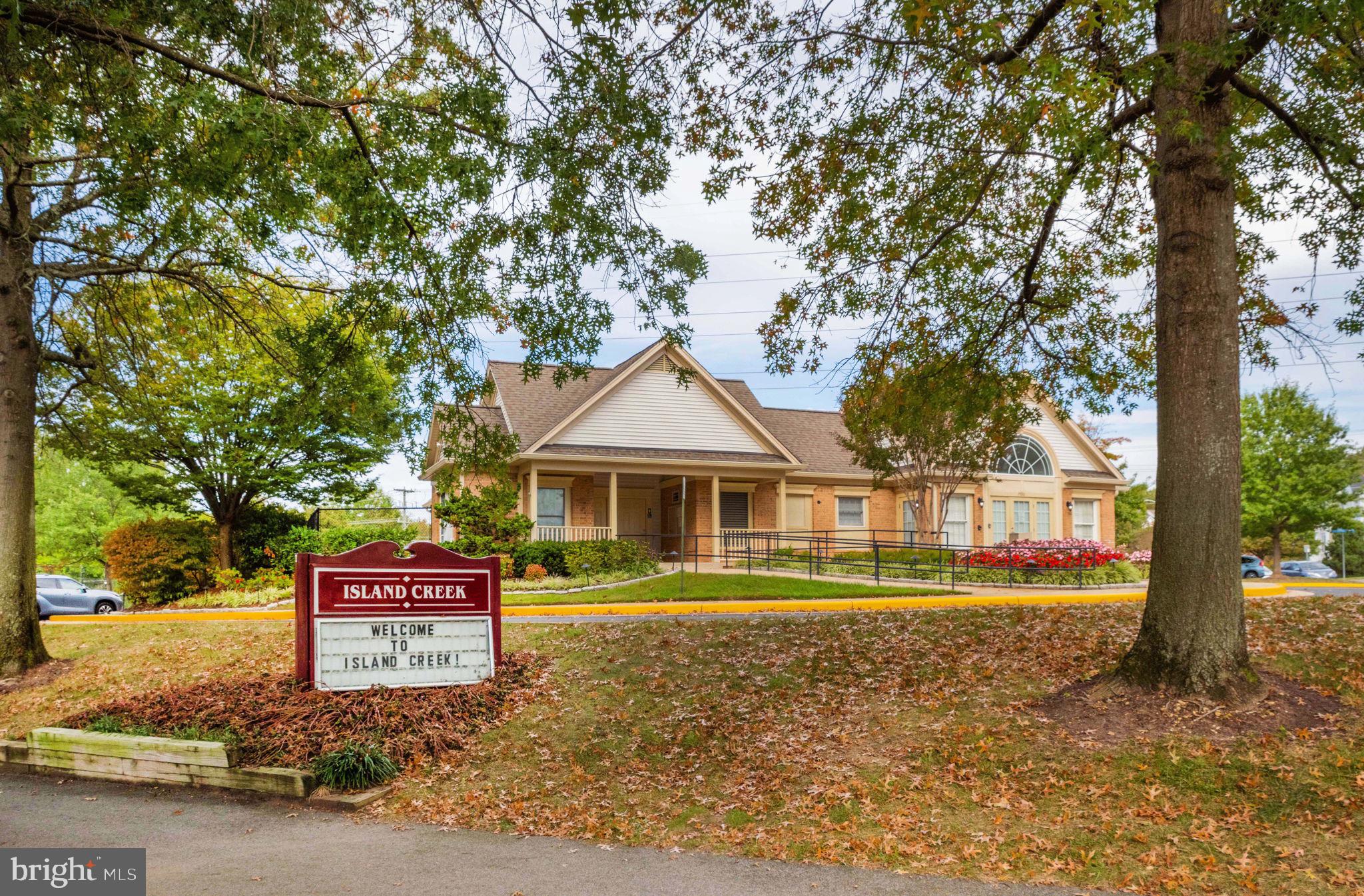 6602 Thackwell Way, Unit C Alexandria, VA 22315 - Photo 44 of 54 a front view of a house with a yard and trees