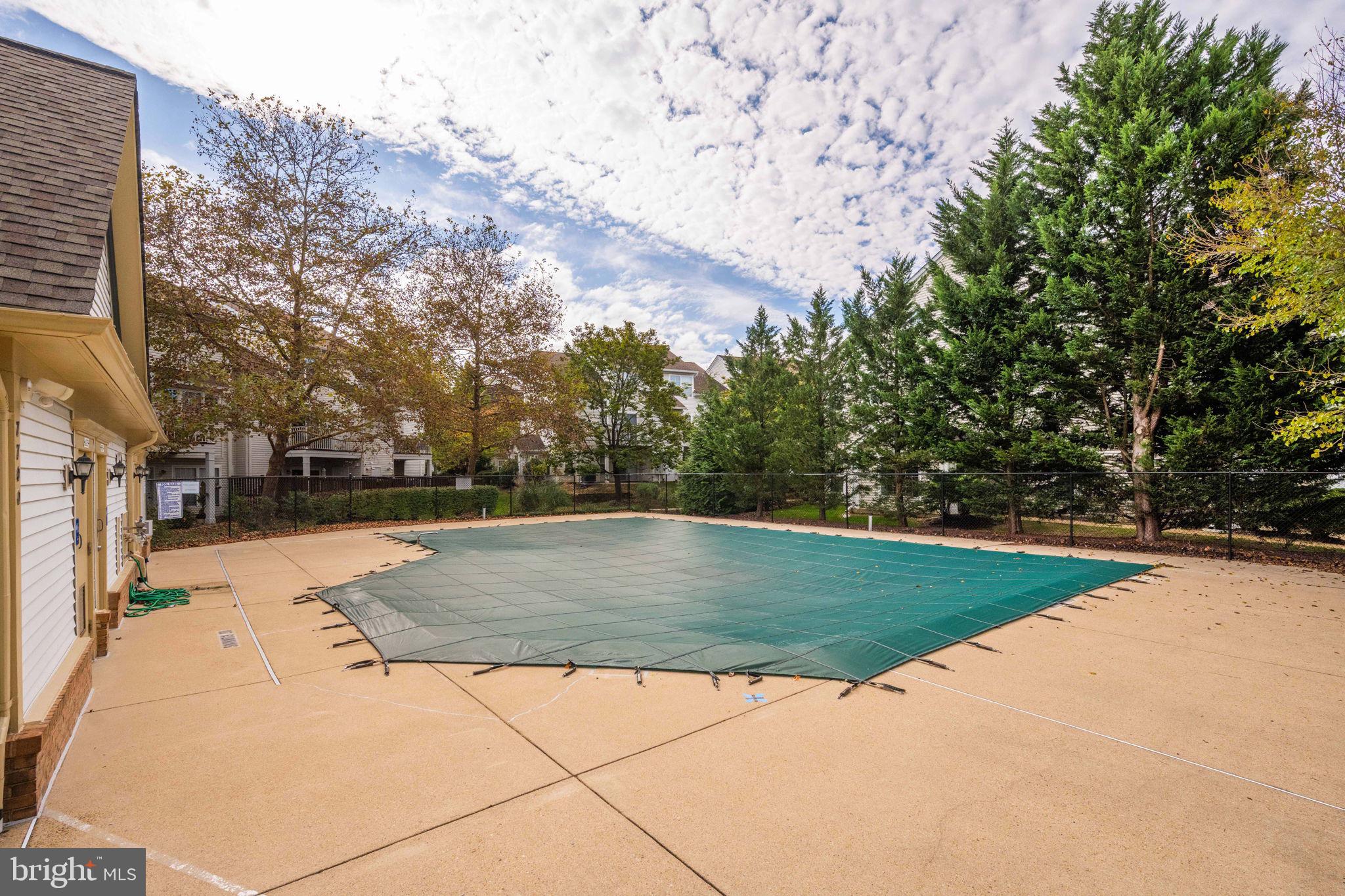 6602 Thackwell Way, Unit C Alexandria, VA 22315 - Photo 48 of 54 a view of a swimming pool with a yard