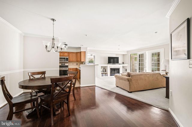 a view of kitchen with furniture and wooden floor