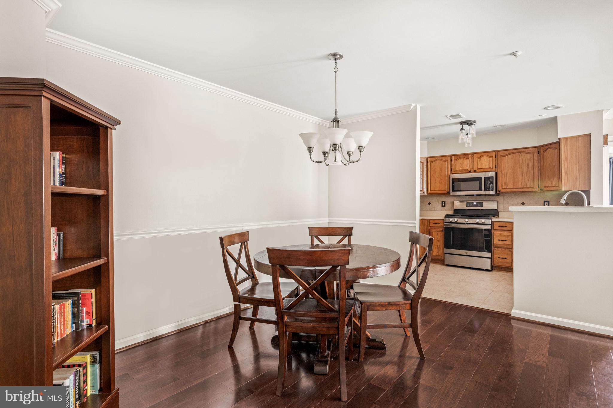 6602 Thackwell Way, Unit C Alexandria, VA 22315 - Photo 10 of 54 a view of a dining room with furniture and wooden floor