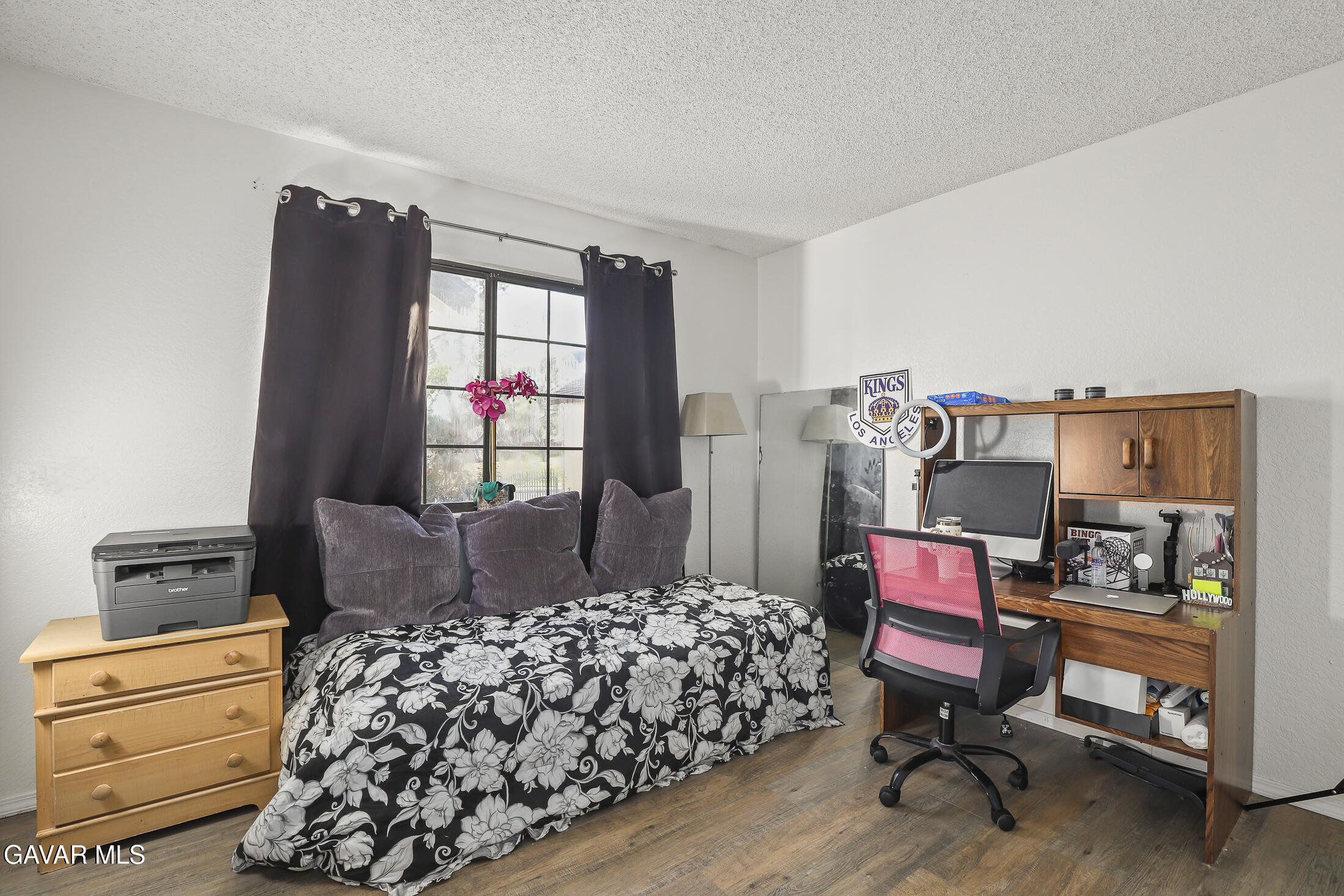 1535 East Ave R 6 Palmdale, CA 93550 - Photo 12 of 23 a bedroom with bed and a window