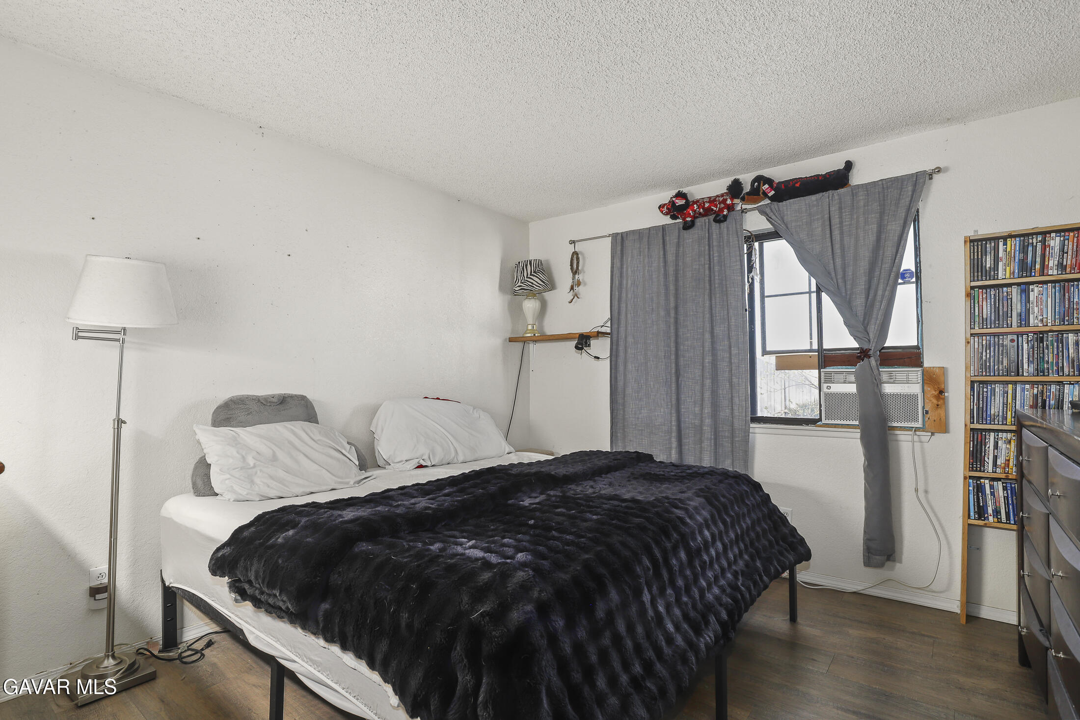 1535 East Ave R 6 Palmdale, CA 93550 - Photo 15 of 23 a bedroom with a bed and a closet