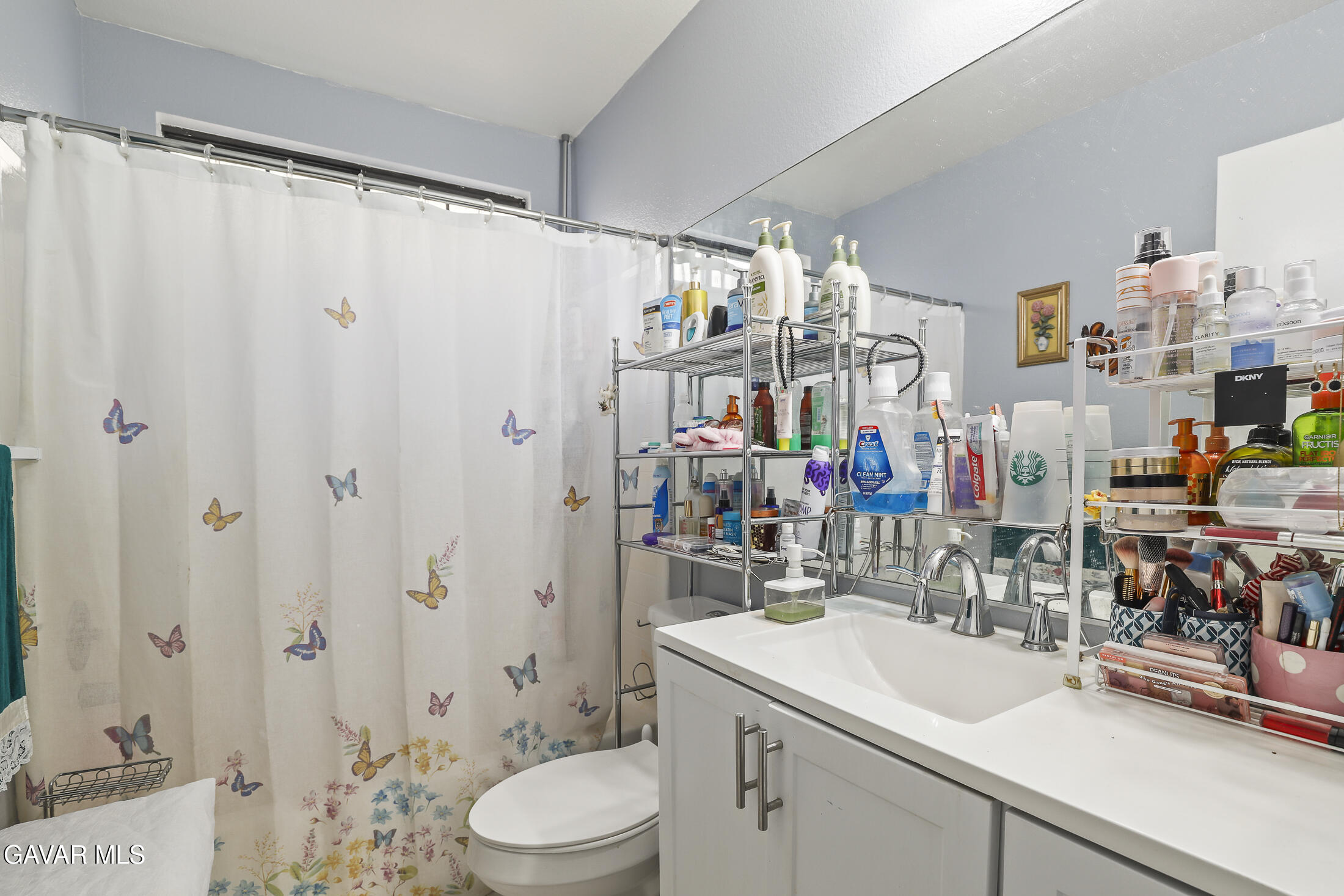 1535 East Ave R 6 Palmdale, CA 93550 - Photo 17 of 23 a bathroom with a sink a toilet and shower