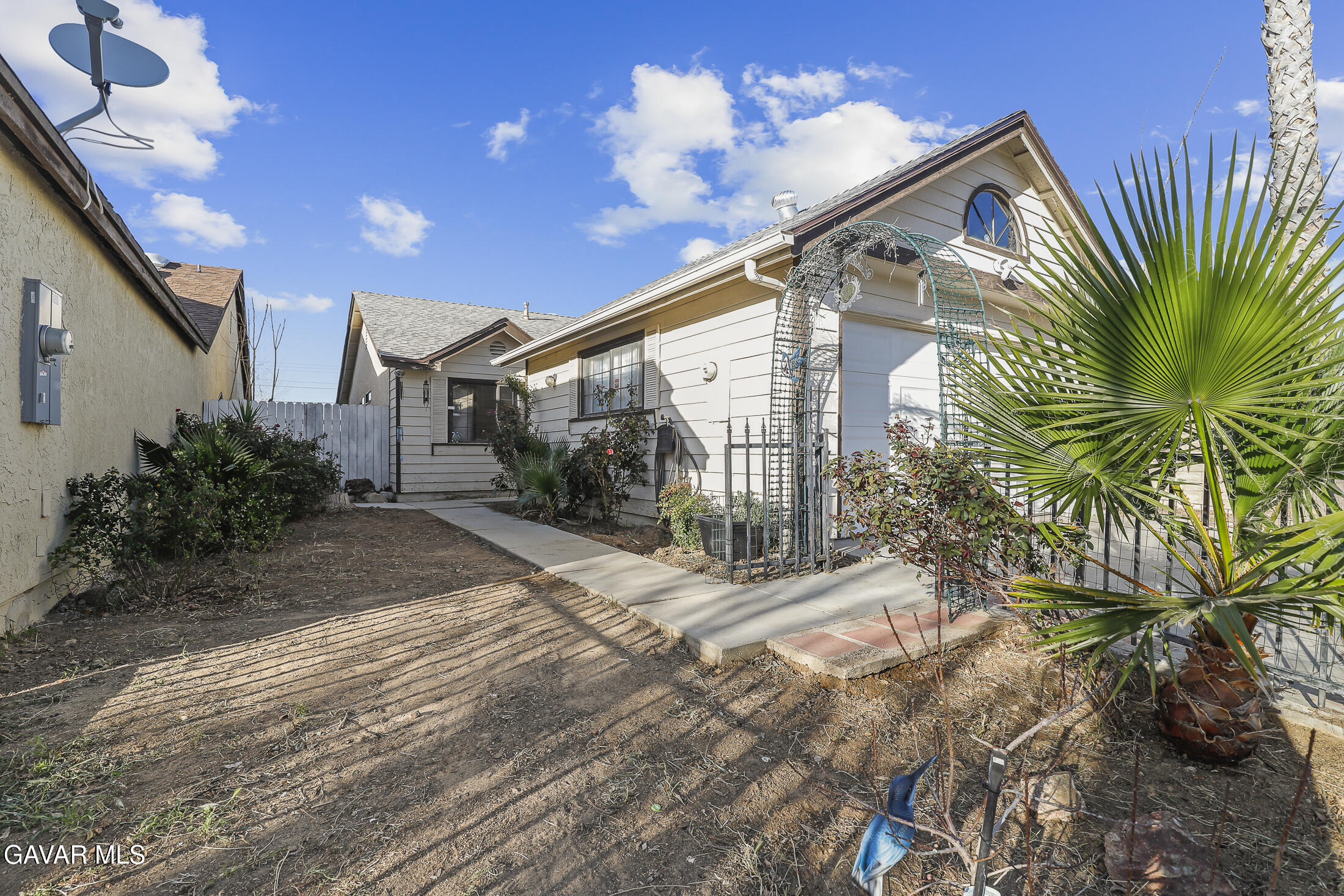 1535 East Ave R 6 Palmdale, CA 93550 - Photo 2 of 23 a view of a house with a yard and potted plants