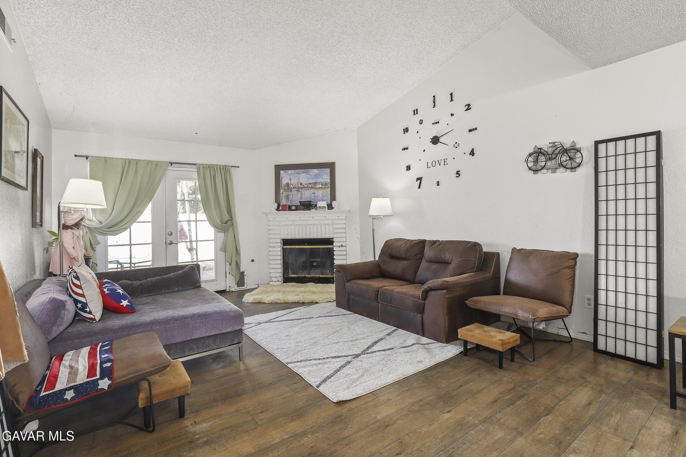 1535 East Ave R 6 Palmdale, CA 93550 - Photo 4 of 23 a living room with furniture and a fireplace