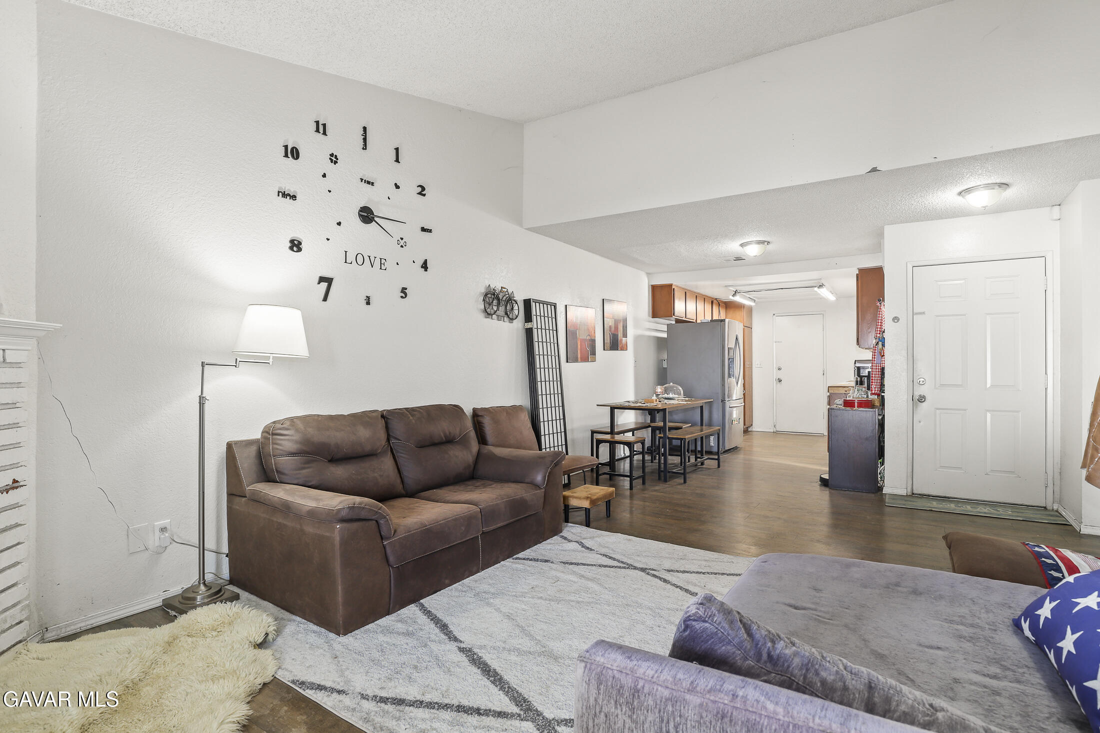 1535 East Ave R 6 Palmdale, CA 93550 - Photo 7 of 23 a living room with furniture and wooden floor