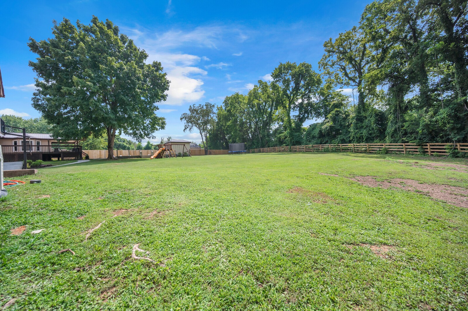 1057 Vanderbilt Road Mount Juliet, TN 37122 - Photo 19 of 39 a view of a green field with trees in the background
