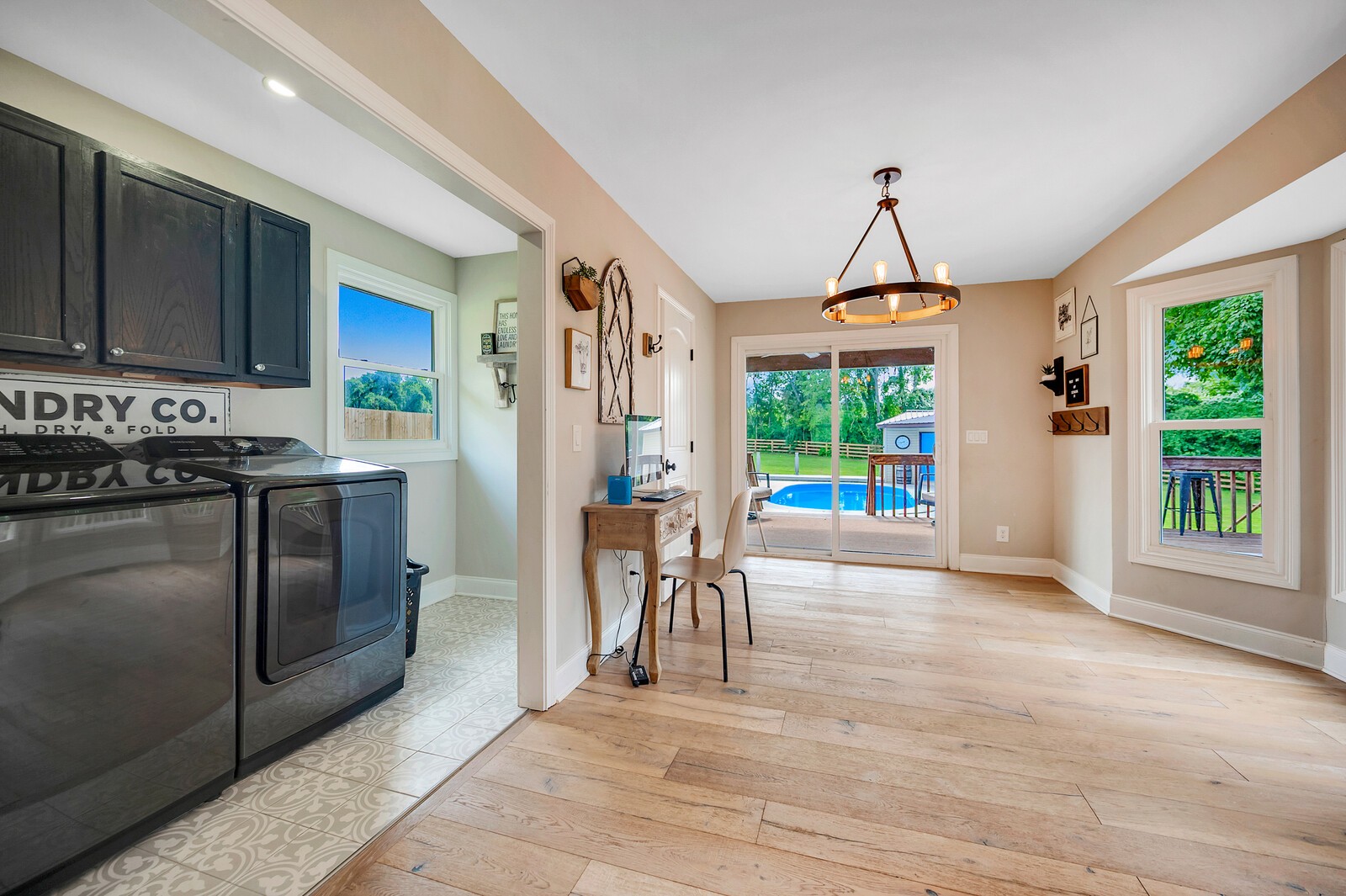 1057 Vanderbilt Road Mount Juliet, TN 37122 - Photo 24 of 39 a kitchen with stainless steel appliances granite countertop a stove a refrigerator a sink a dining table and chairs with wooden floor
