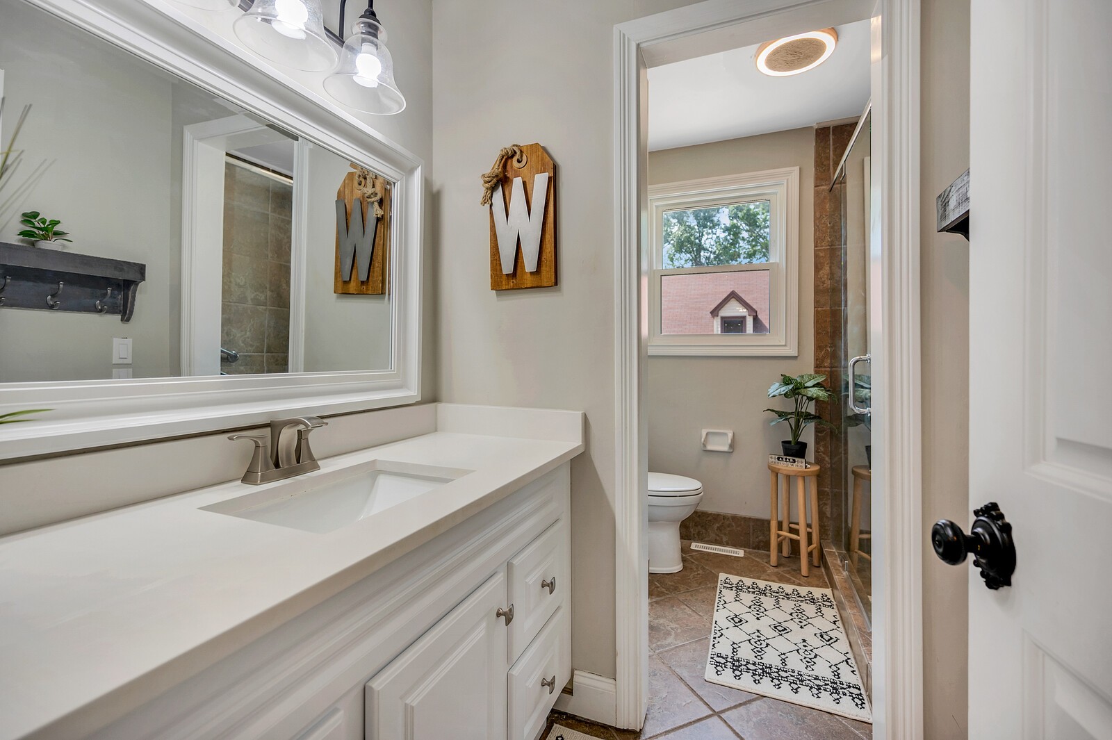 1057 Vanderbilt Road Mount Juliet, TN 37122 - Photo 32 of 39 a bathroom with a sink and mirror with toilet