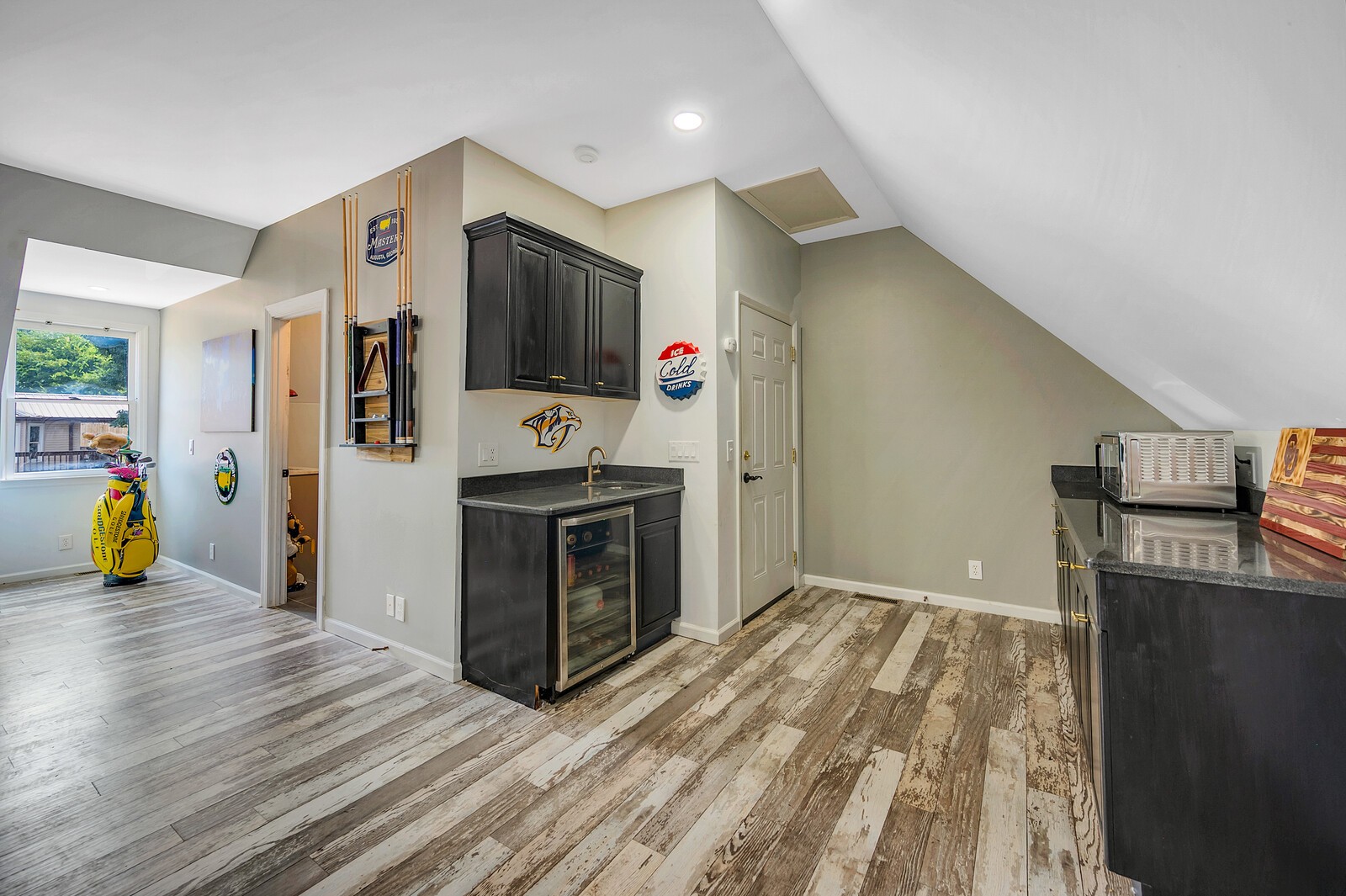 1057 Vanderbilt Road Mount Juliet, TN 37122 - Photo 38 of 39 a view of a kitchen with fridge and wooden floor