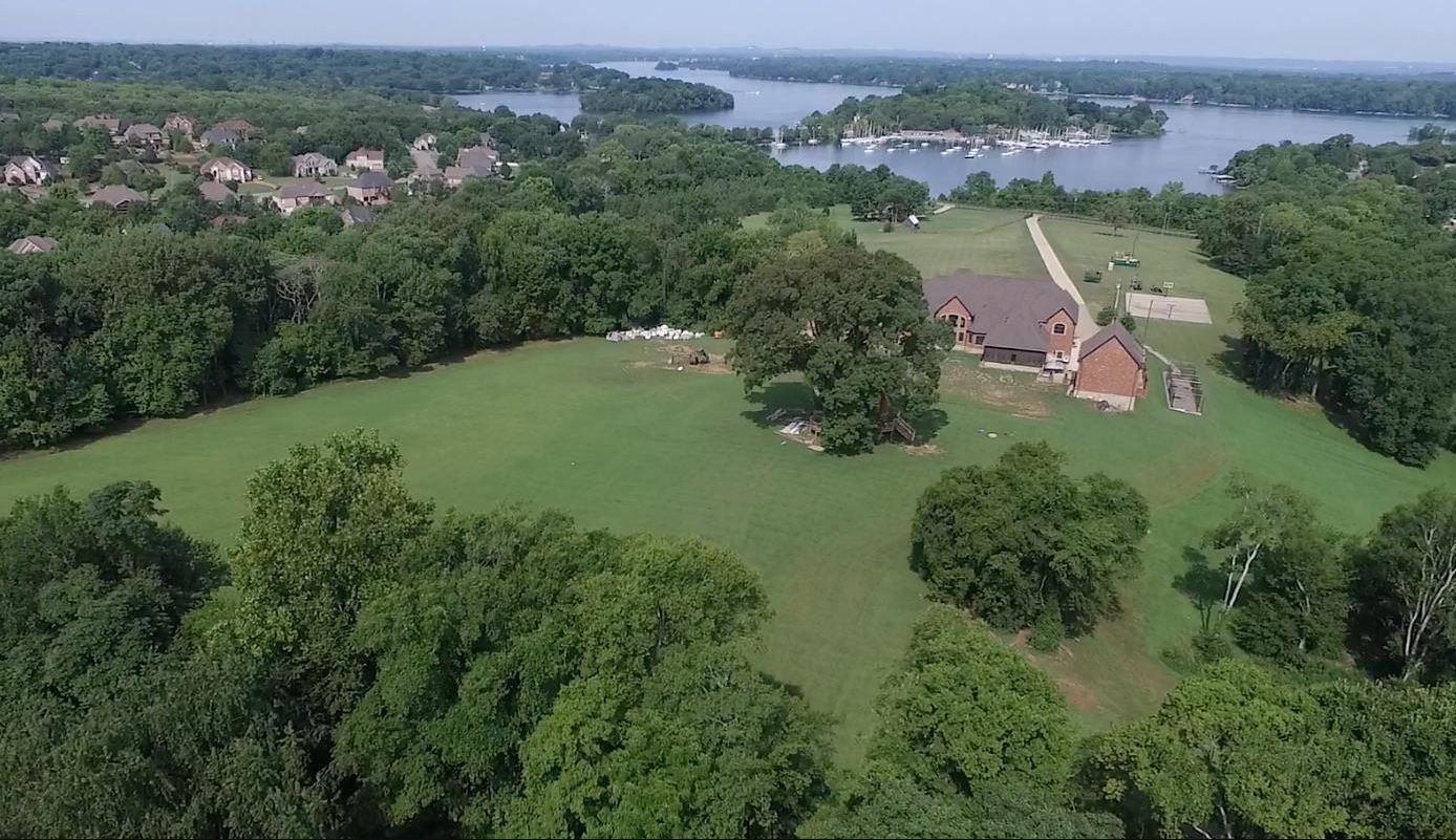 1057 Vanderbilt Road Mount Juliet, TN 37122 - Photo 5 of 39 an aerial view of green landscape with trees houses and mountain view