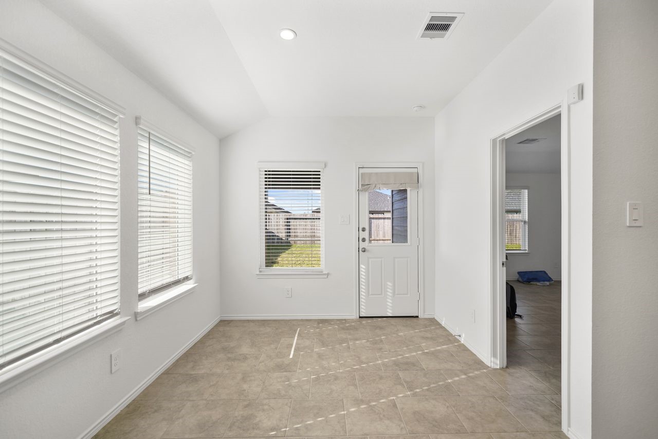 7502 Fierce Friesian Lane Rosharon, TX 77583 - Photo 8 of 21 a view of an empty room with a window
