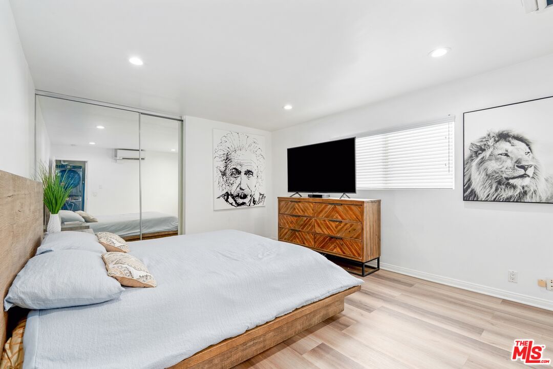 3806 Ocean Front Walk, Unit 2 Marina del Rey, CA 90292 - Photo 14 of 26 a bedroom with a bed and a flat screen tv