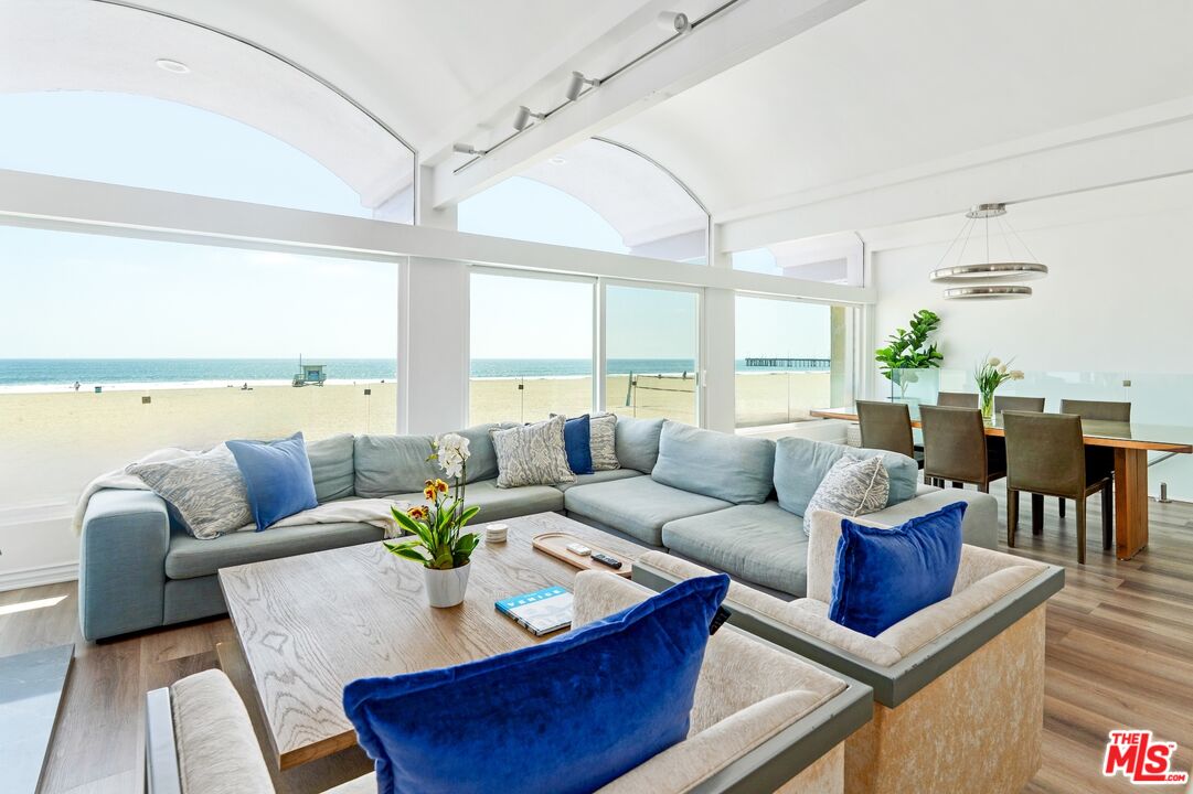 3806 Ocean Front Walk, Unit 2 Marina del Rey, CA 90292 - Photo 2 of 26 a living room with furniture and a large window