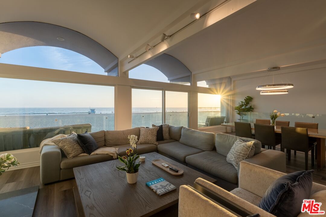 3806 Ocean Front Walk, Unit 2 Marina del Rey, CA 90292 - Photo 9 of 26 a living room with furniture and a floor to ceiling window