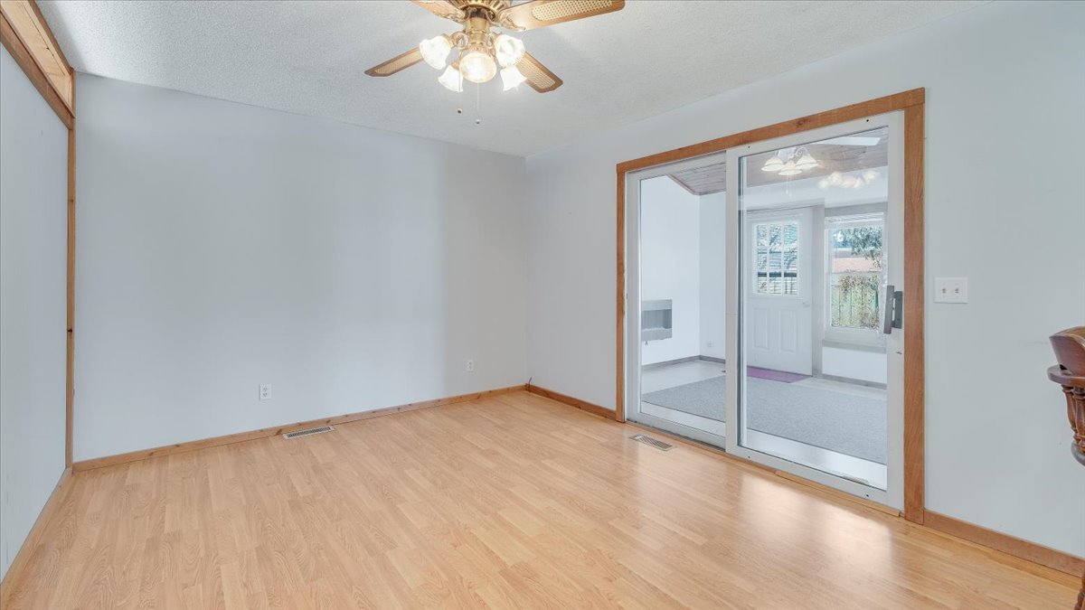 1504 Harrington Drive Champaign, IL 61821 - Photo 11 of 40 a view of an empty room with glass door