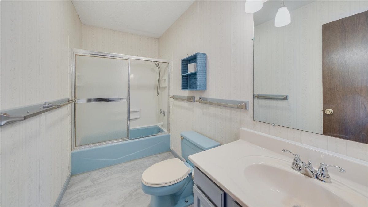 1504 Harrington Drive Champaign, IL 61821 - Photo 22 of 40 a bathroom with a sink a toilet and shower