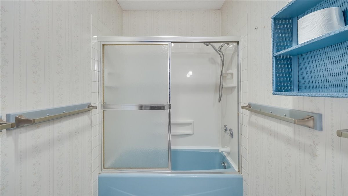 1504 Harrington Drive Champaign, IL 61821 - Photo 23 of 40 a bathroom with a glass shower door