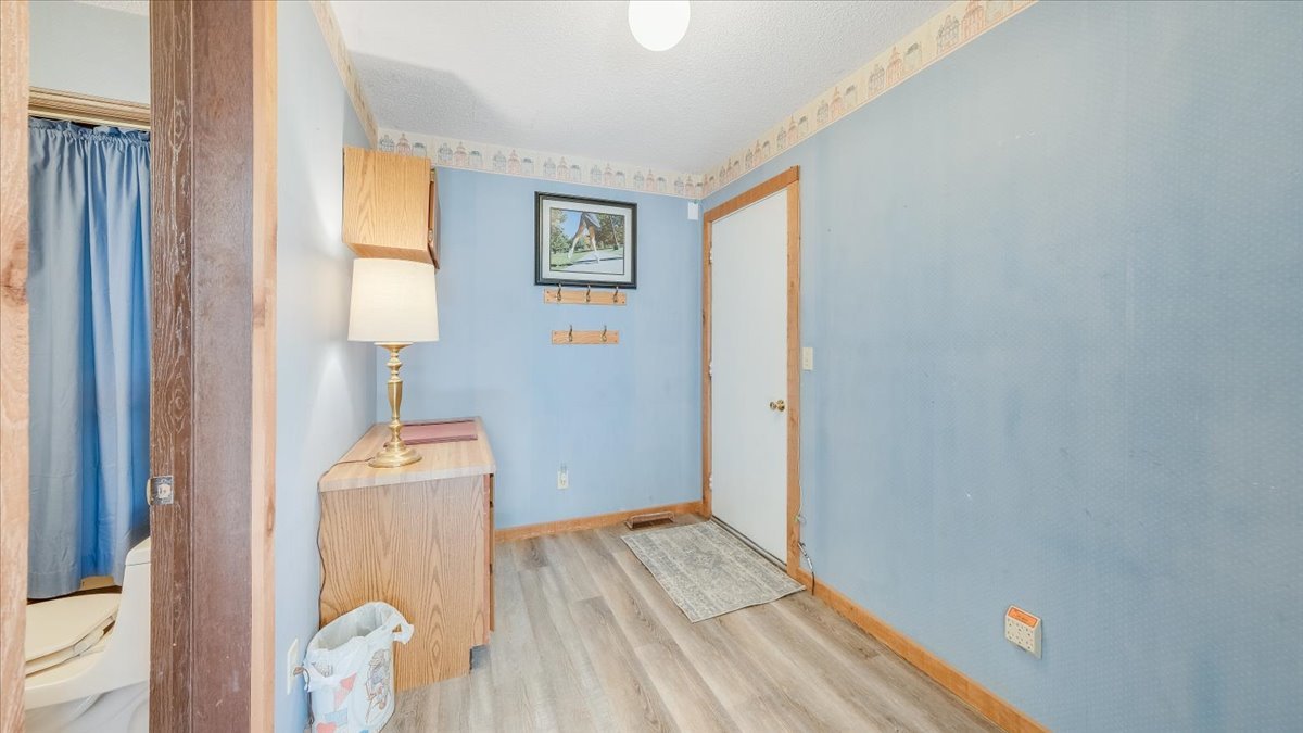 1504 Harrington Drive Champaign, IL 61821 - Photo 27 of 40 a view of empty room with wooden floor and fan