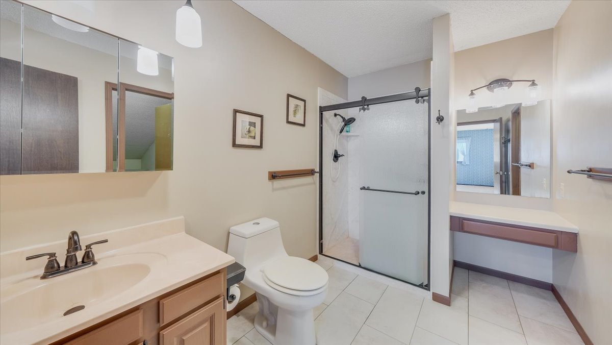 1504 Harrington Drive Champaign, IL 61821 - Photo 29 of 40 a bathroom with a sink toilet and shower