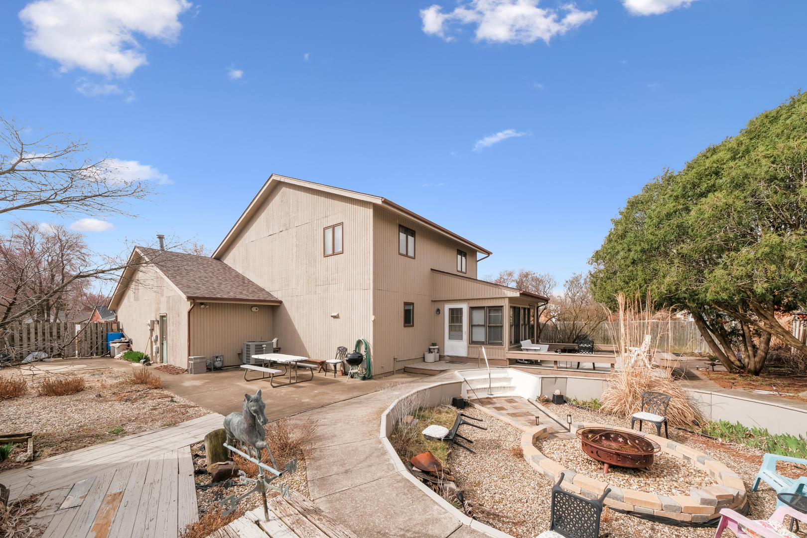 1504 Harrington Drive Champaign, IL 61821 - Photo 38 of 40 a view of a house with backyard and sitting area