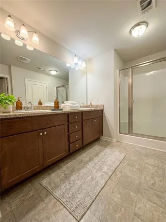 a room with a sink and cabinets