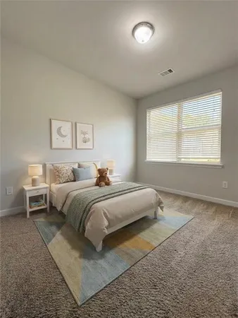 a bedroom with bed and a window