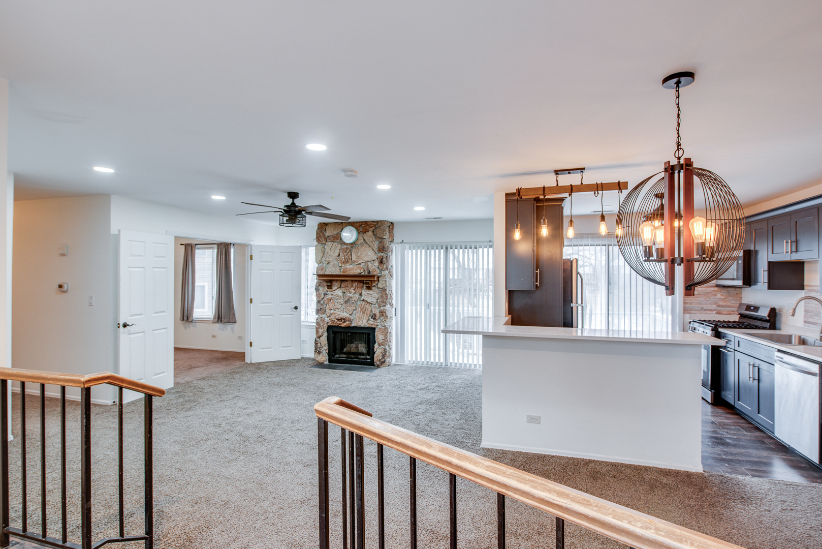 340 Springlake Lane, Unit D Aurora, IL 60504 - Photo 2 of 15 a kitchen with stainless steel appliances granite countertop a refrigerator a stove and a sink