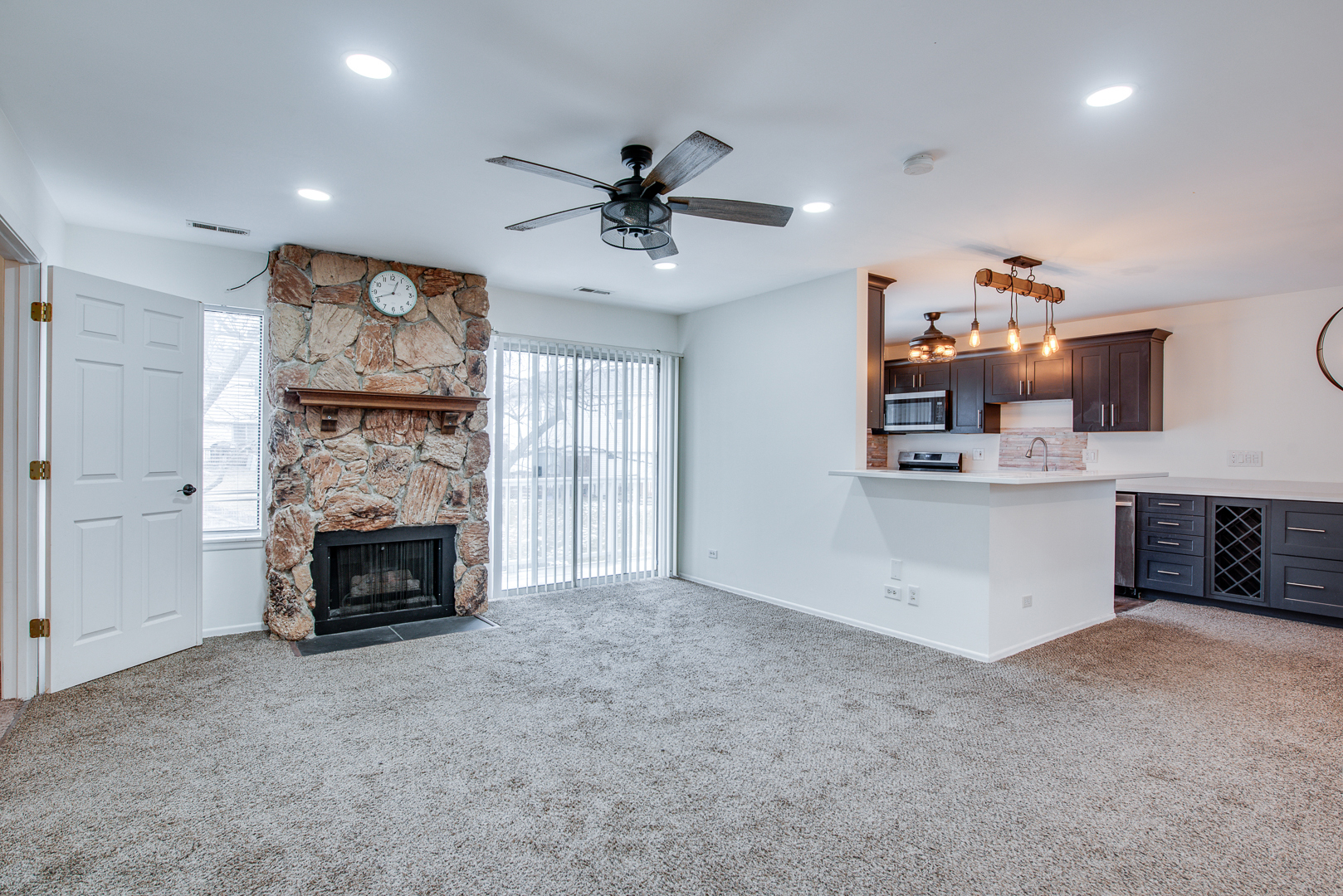 340 Springlake Lane, Unit D Aurora, IL 60504 - Photo 4 of 15 a living room with furniture and a fireplace