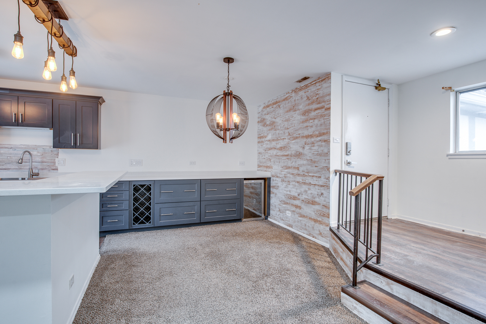340 Springlake Lane, Unit D Aurora, IL 60504 - Photo 6 of 15 a room with a cabinets and chandelier