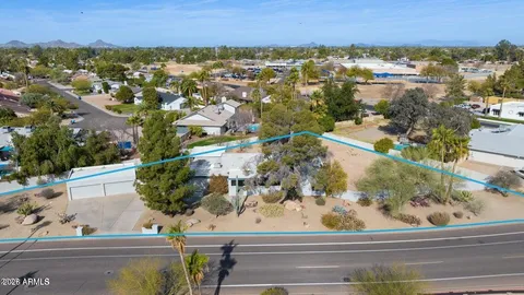 an aerial view of residential house with outdoor space and mountain view