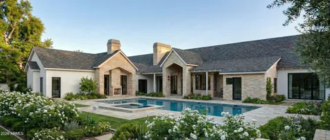 a view of house with a garden and yard