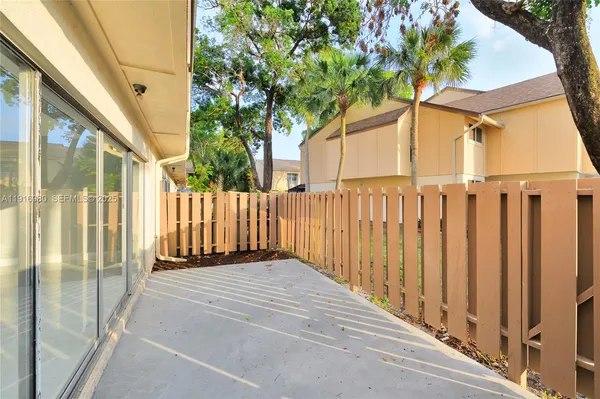 a view of a door with a small yard