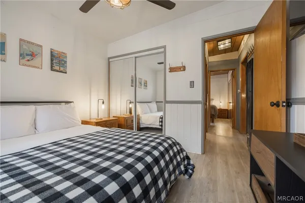 a bedroom with a bed and a walk in closet