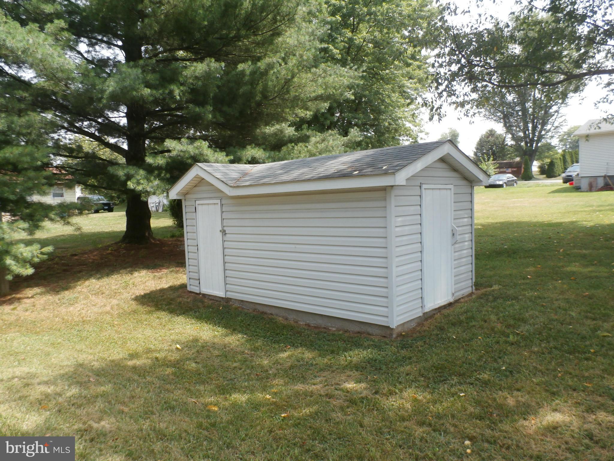 54 Crab Apple Lane Ranson, WV 25438 - Photo 4 of 16 Shed. Noter trees again