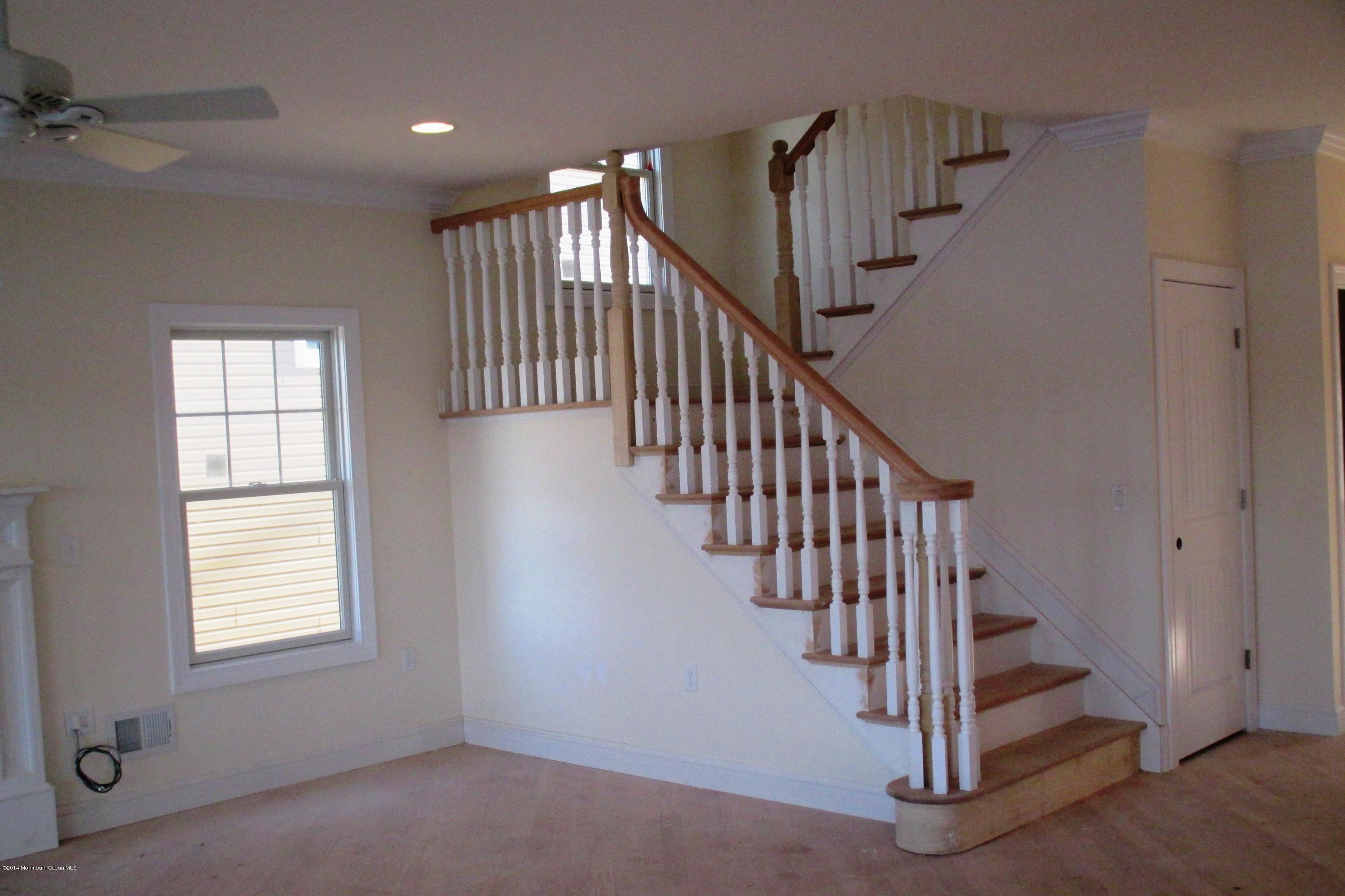 632 Harbor Road Brick, NJ 08724 - Photo 6 of 9 a view of staircase with white walls and windows