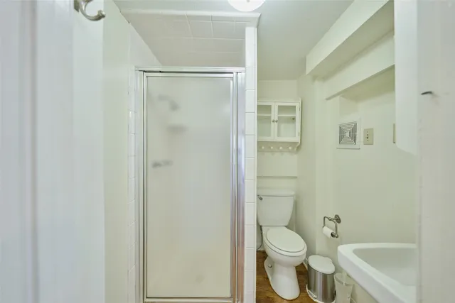a white refrigerator freezer and a stove sitting inside of a kitchen