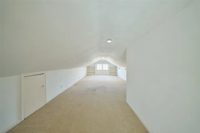 a view of a house with a wooden deck