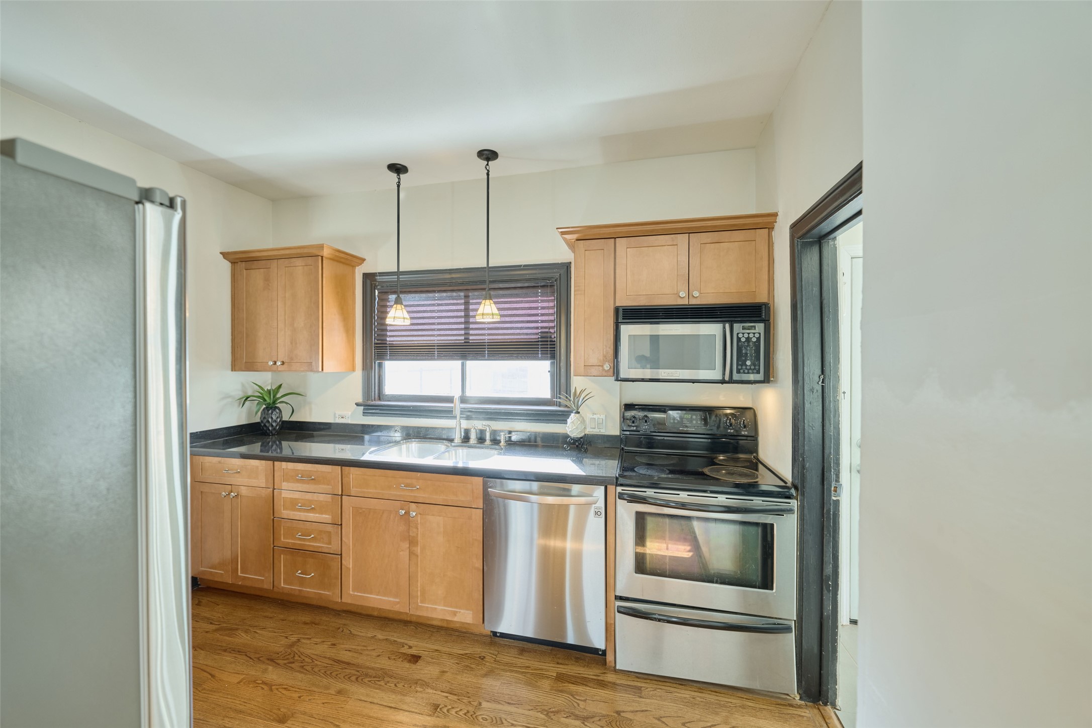1111 Rutland Street Houston, TX 77008 - Photo 3 of 43 a kitchen with stainless steel appliances granite countertop a stove and cabinets