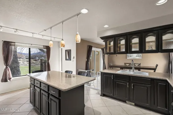 a kitchen with a stove a sink and a refrigerator