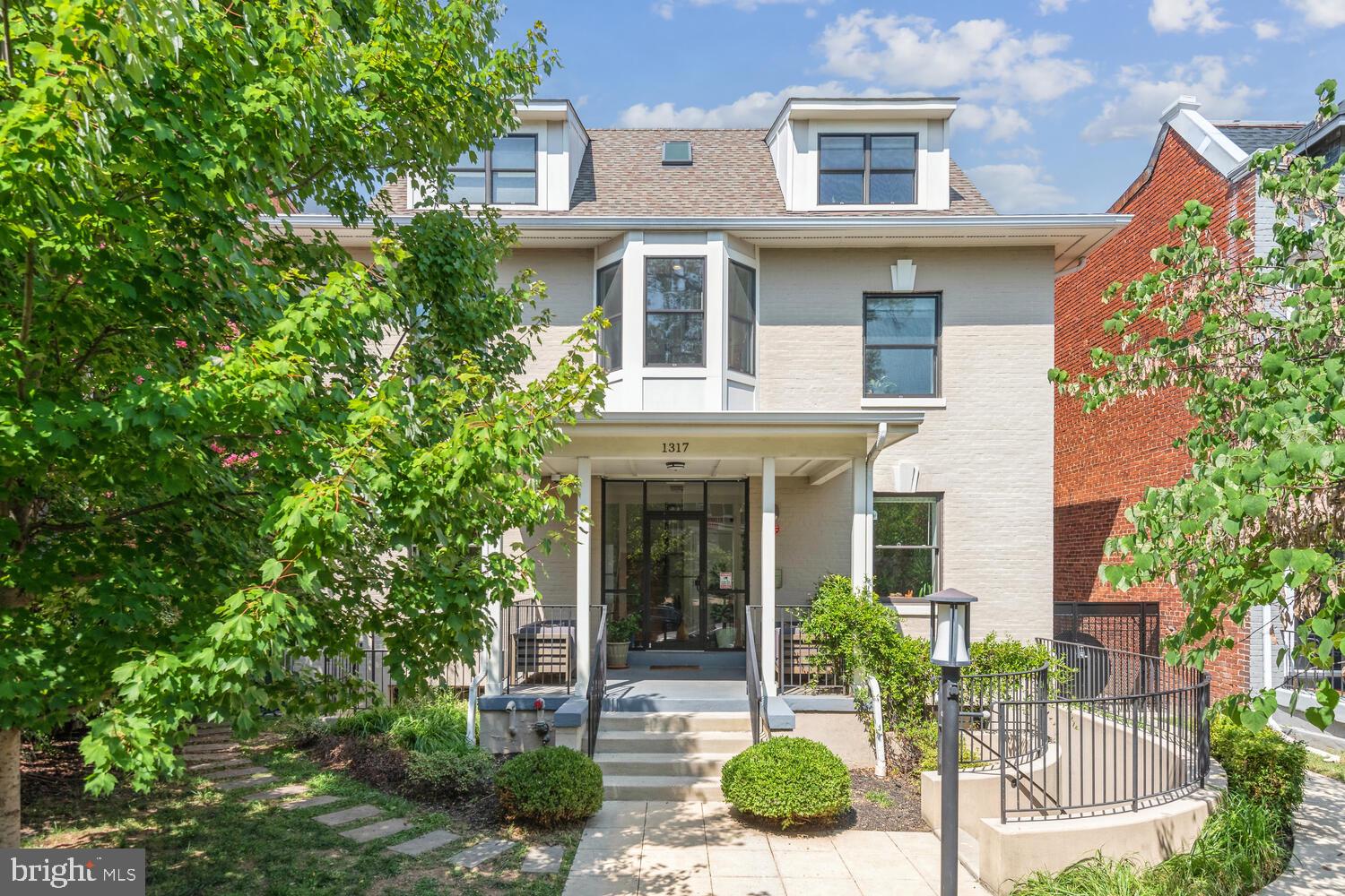1317 Shepherd Street Northwest, Unit A Washington, DC 20011 - Photo 2 of 17 a front view of a house with porch