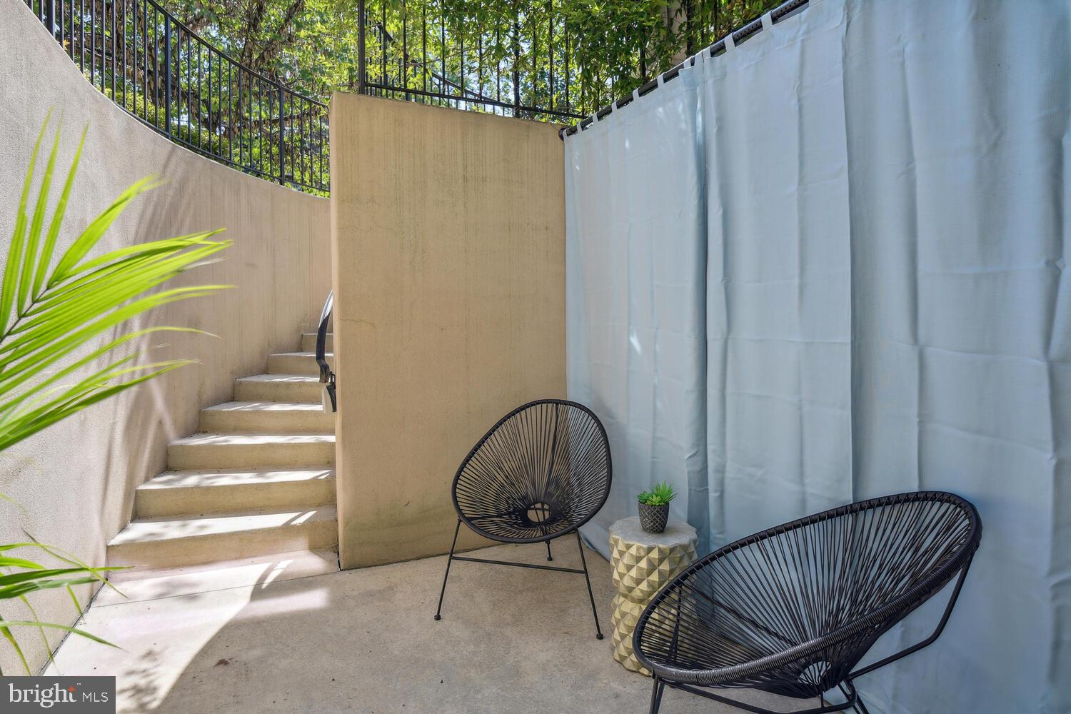 1317 Shepherd Street Northwest, Unit A Washington, DC 20011 - Photo 3 of 17 a view of balcony with wooden floor and outdoor seating
