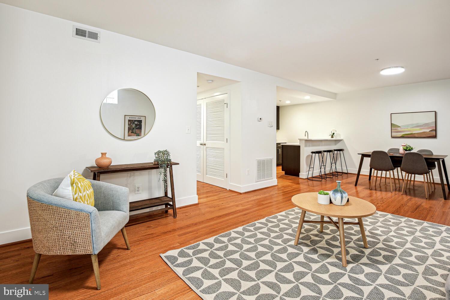1317 Shepherd Street Northwest, Unit A Washington, DC 20011 - Photo 6 of 17 a living room with furniture and a wooden floor