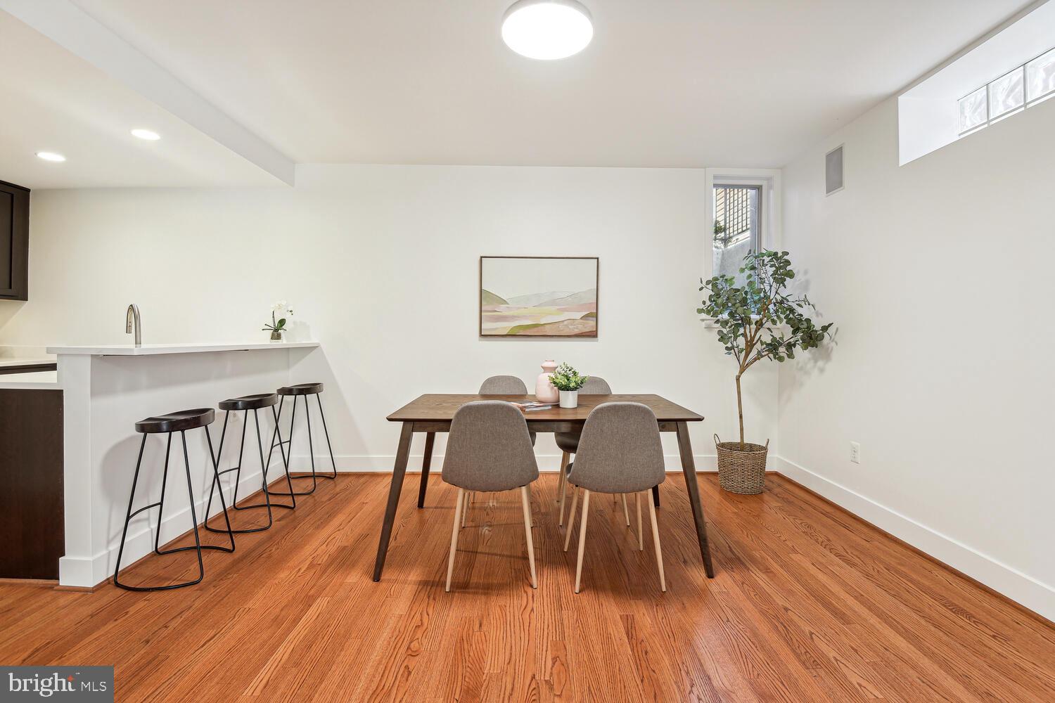 1317 Shepherd Street Northwest, Unit A Washington, DC 20011 - Photo 8 of 17 a view of a dining room with furniture and wooden floor