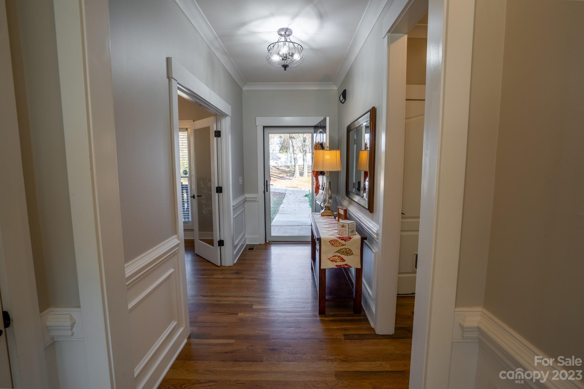1411 Mary Ellen Drive Fort Mill, SC 29708 - Photo 13 of 37 a view of a hallway view with wooden floor and staircase