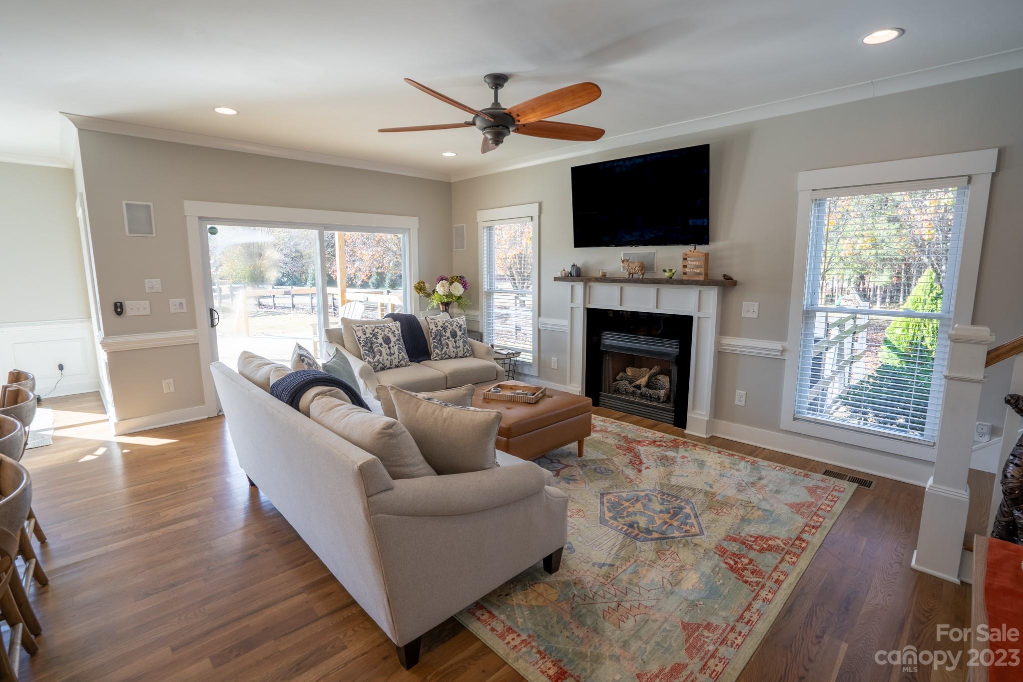 1411 Mary Ellen Drive Fort Mill, SC 29708 - Photo 20 of 37 a living room with furniture a fireplace and a flat screen tv