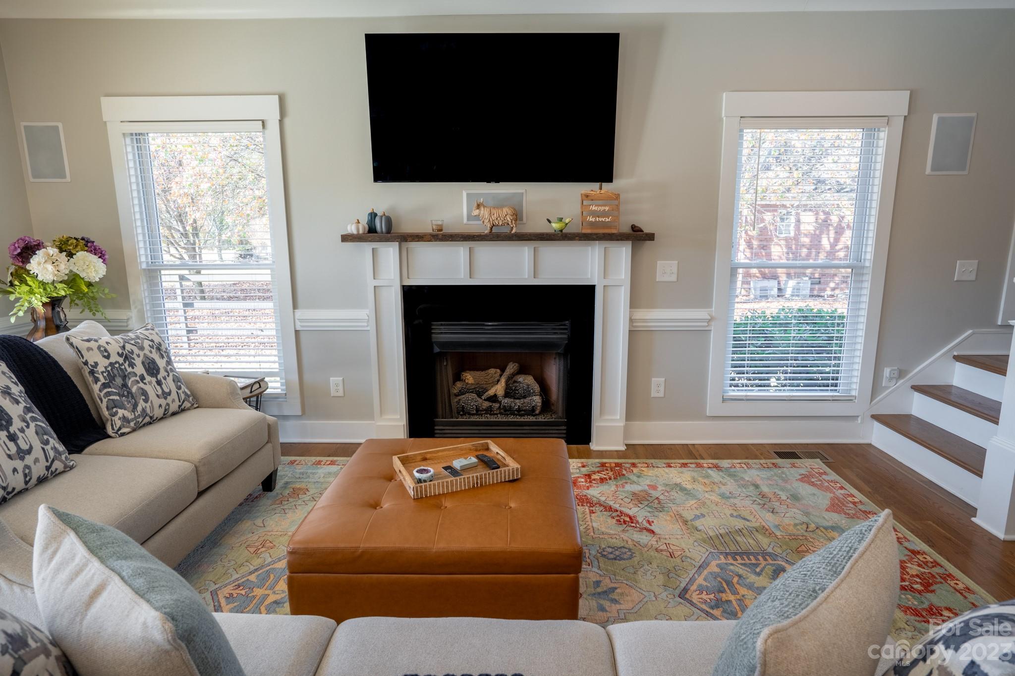 1411 Mary Ellen Drive Fort Mill, SC 29708 - Photo 21 of 37 a living room with furniture a flat screen tv and a fireplace
