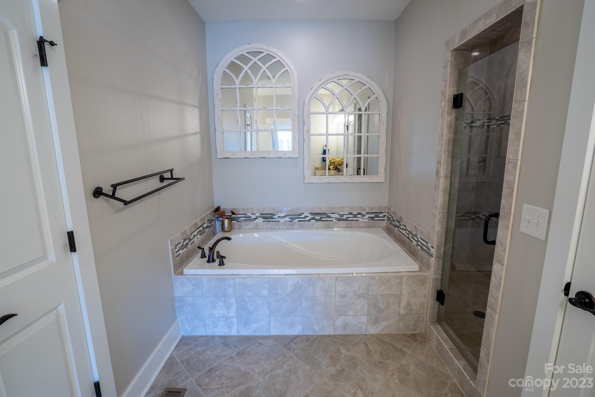 1411 Mary Ellen Drive Fort Mill, SC 29708 - Photo 27 of 37 a bath tub sitting in a bathroom next to a sink