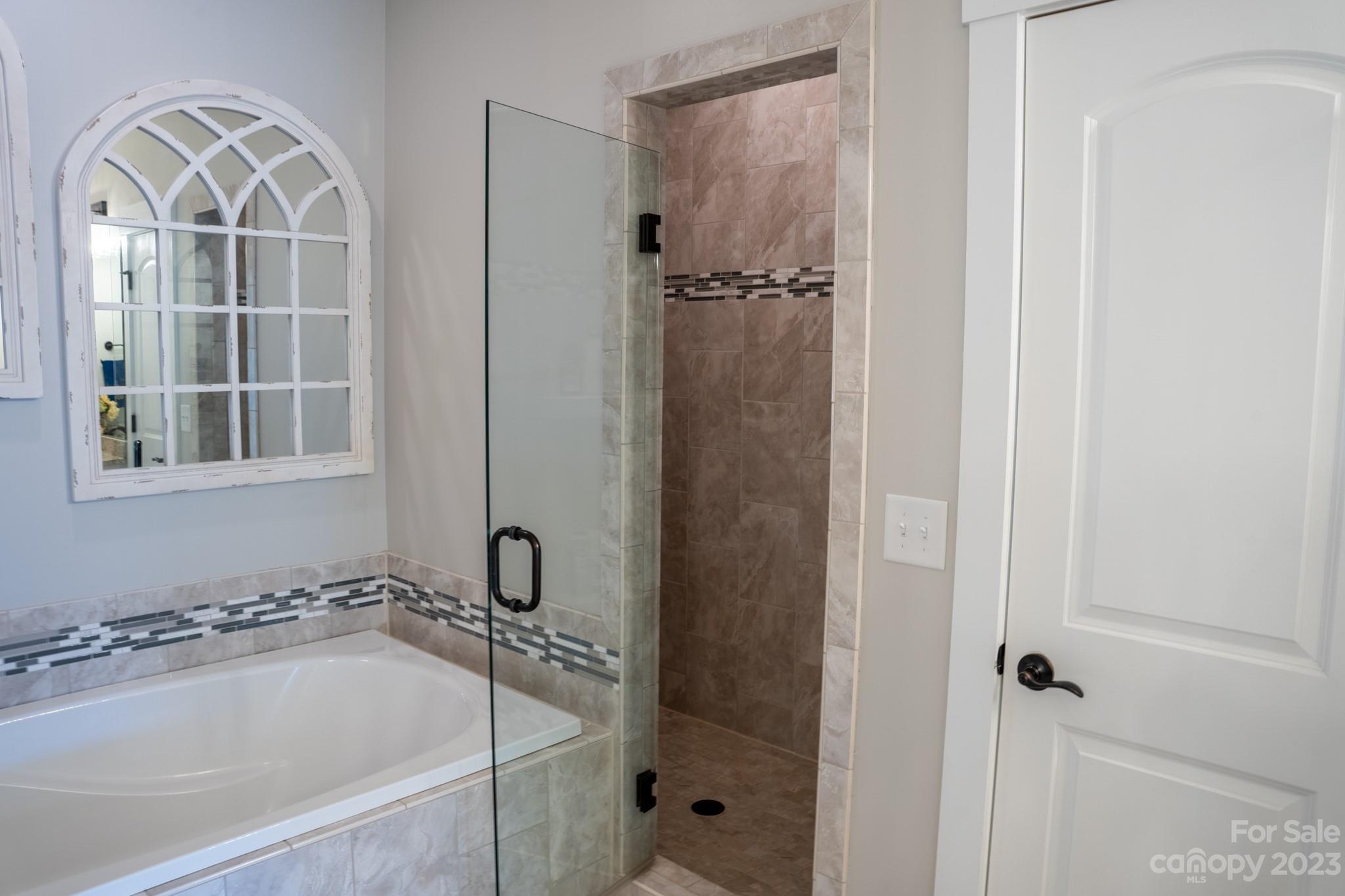 1411 Mary Ellen Drive Fort Mill, SC 29708 - Photo 28 of 37 a bathroom with a tub and a shower