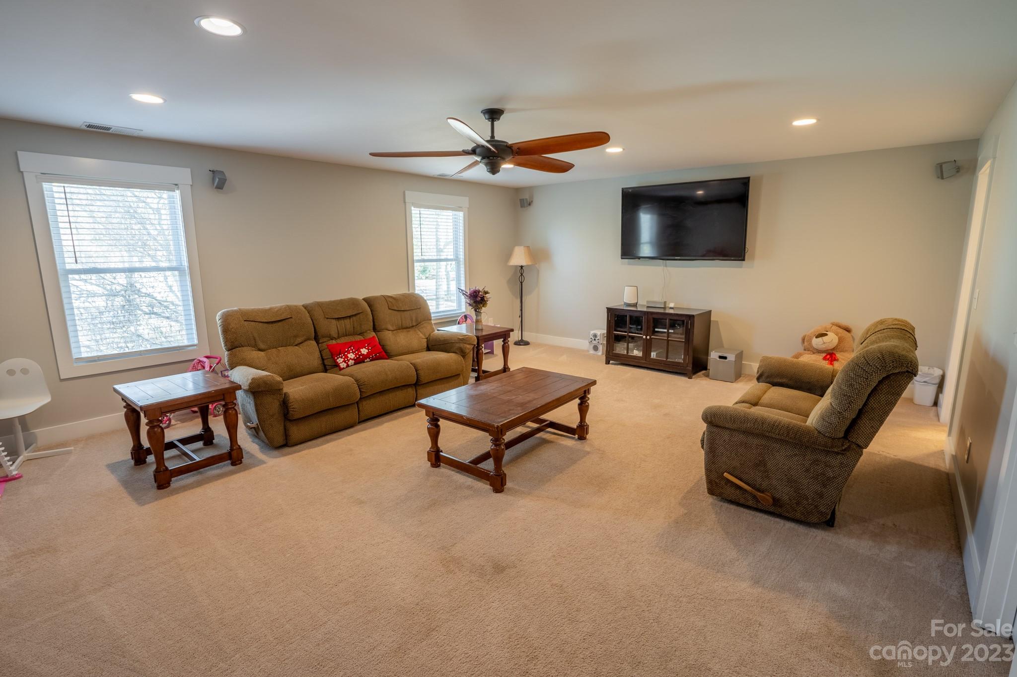 1411 Mary Ellen Drive Fort Mill, SC 29708 - Photo 37 of 37 a living room with furniture a flat screen tv and a window